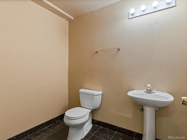 10216 Kleinbrook Way, Highlands Ranch, CO 80126 - half bath with toilet and tile patterned floors