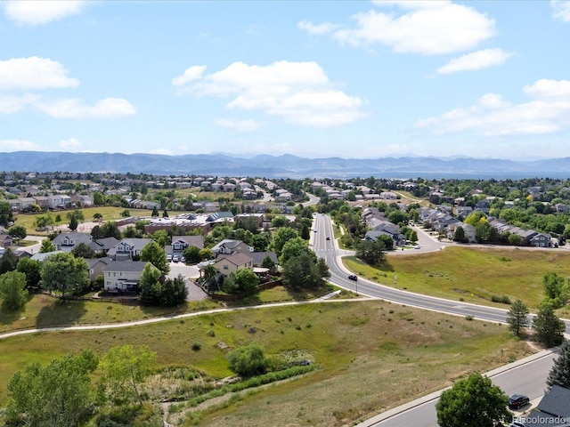10216 Kleinbrook Way, Highlands Ranch, CO 80126 - aerial perspective of suburban area with mountains and property boundaries highlighted
