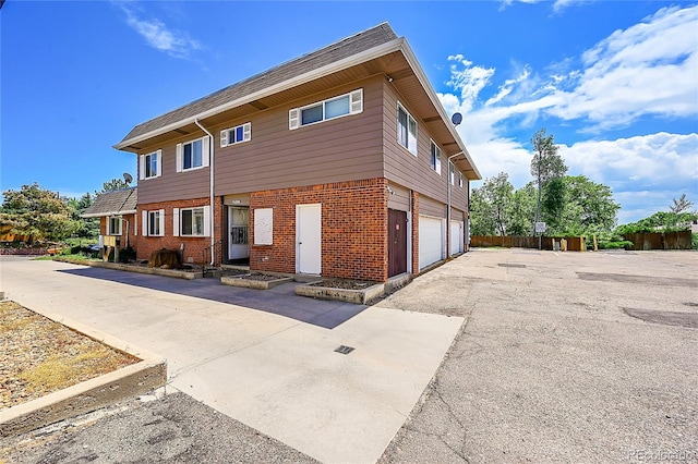 view of side of home with a garage