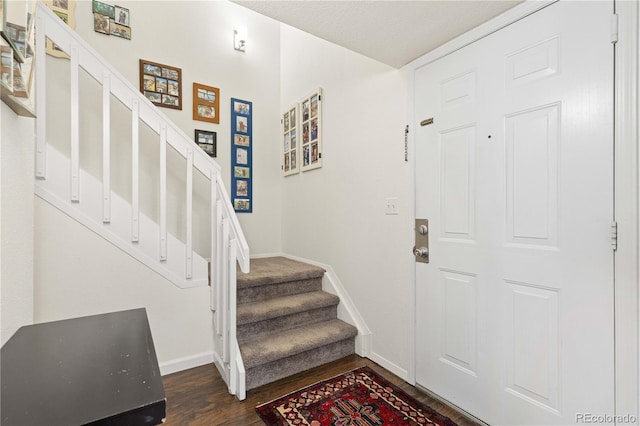 entrance foyer with dark hardwood / wood-style flooring