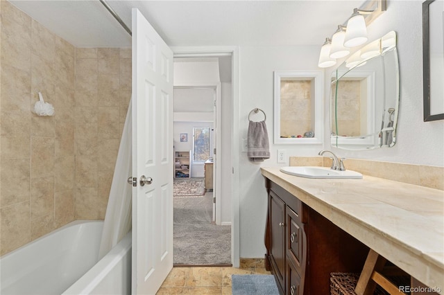 bathroom featuring vanity and shower / bathtub combination with curtain