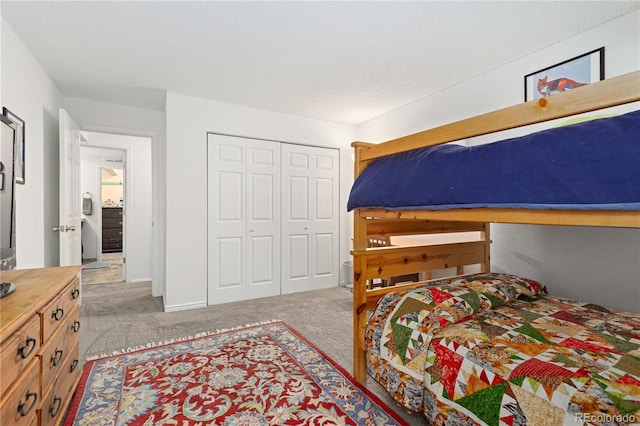 carpeted bedroom with a closet