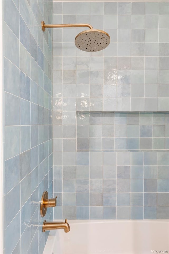 full bathroom with shower / washtub combination