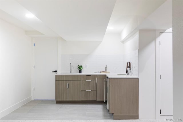 bar featuring recessed lighting, light tile patterned floors, indoor wet bar, and a sink
