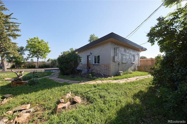 1075 S Ames St, Lakewood, CO 80226 - view of property exterior with stucco siding and stone siding