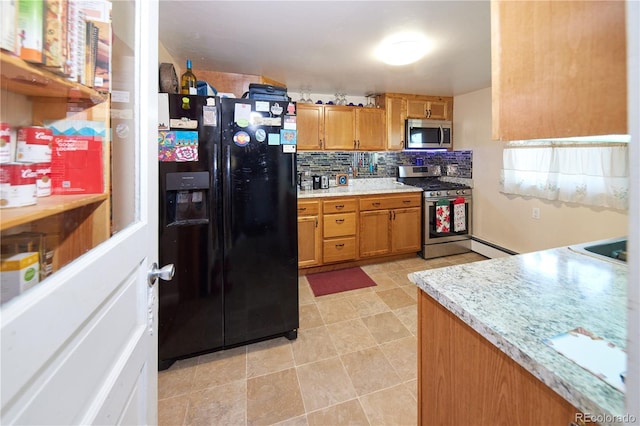 1075 S Ames St, Lakewood, CO 80226 - kitchen featuring appliances with stainless steel finishes, tasteful backsplash, light countertops, and brown cabinets