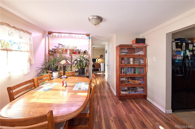 1075 S Ames St, Lakewood, CO 80226 - dining room with wood finished floors and baseboards