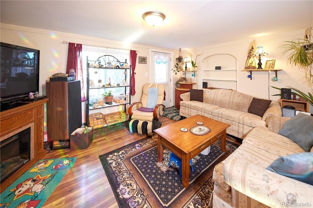 1075 S Ames St, Lakewood, CO 80226 - living area with wood finished floors and a glass covered fireplace
