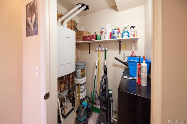 1075 S Ames St, Lakewood, CO 80226 - utility room featuring water heater
