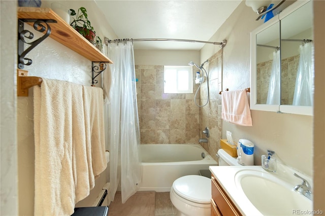 1075 S Ames St, Lakewood, CO 80226 - full bathroom featuring shower / bath combo with shower curtain, vanity, tile patterned floors, and baseboard heating