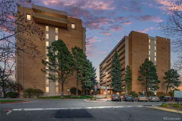 view of outdoor building at dusk