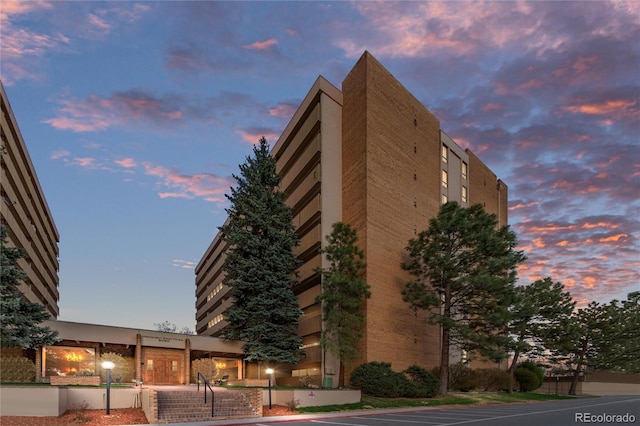 view of outdoor building at dusk