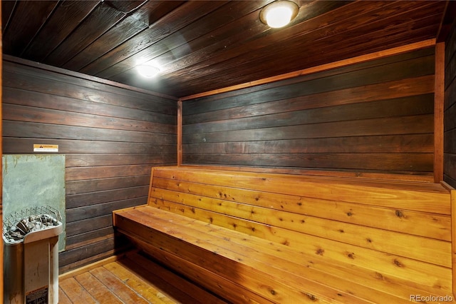 view of sauna / steam room featuring wood ceiling, wood walls, and hardwood / wood-style flooring