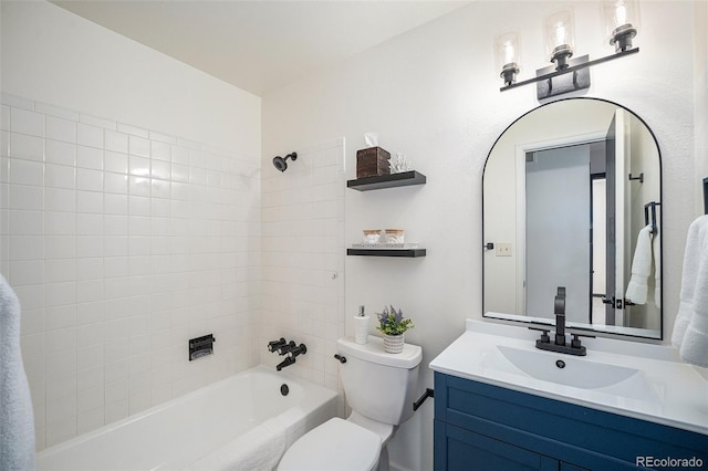 bathroom with vanity, toilet, and bathing tub / shower combination