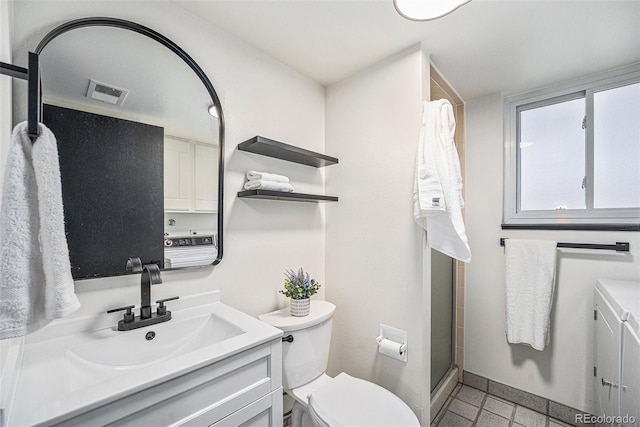 bathroom featuring visible vents, a stall shower, toilet, and vanity