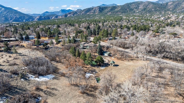 birds eye view of property featuring a mountain view