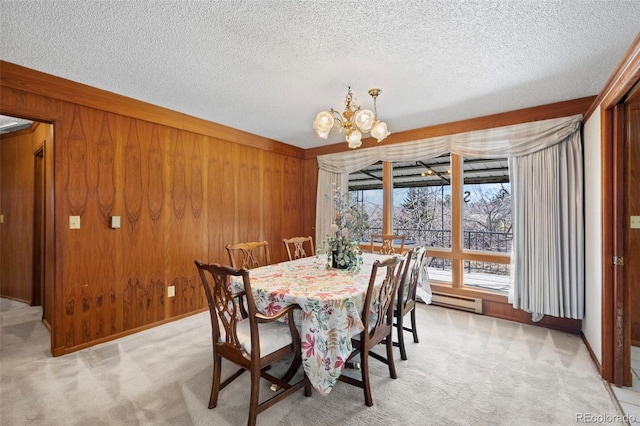 dining space with light carpet and wood walls