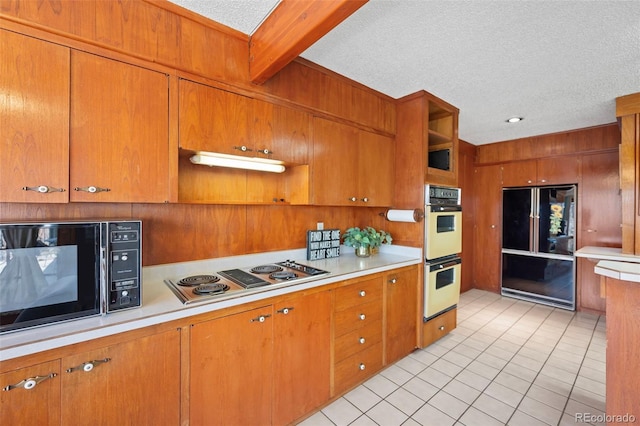 kitchen featuring black appliances, light tile patterned floors, open shelves, and light countertops