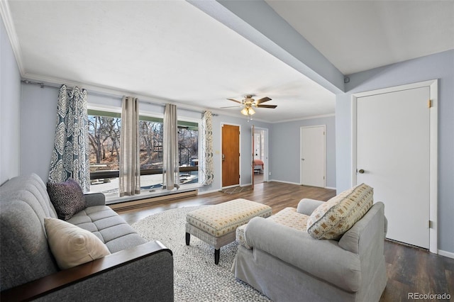 living area with crown molding, a baseboard heating unit, ceiling fan, wood finished floors, and baseboards