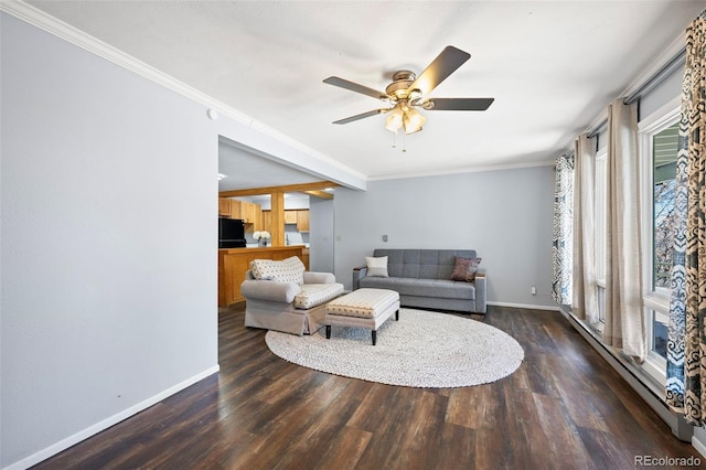 living room featuring crown molding, wood finished floors, and baseboards