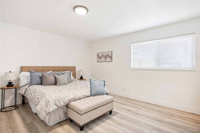 bedroom with hardwood / wood-style floors