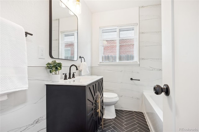 bathroom featuring vanity, toilet, and tile walls