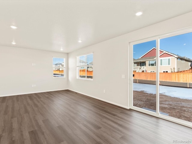 unfurnished room featuring dark wood-type flooring