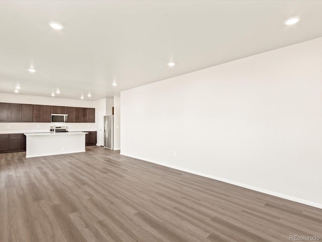 unfurnished living room featuring light hardwood / wood-style flooring