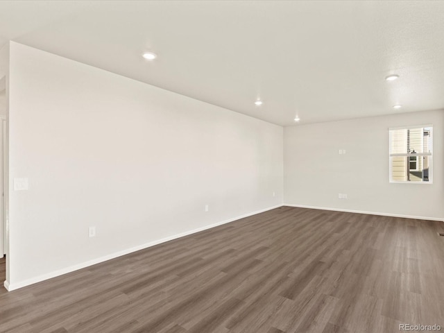 empty room featuring dark hardwood / wood-style floors