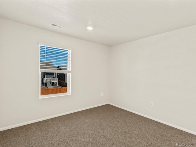 spare room featuring carpet flooring