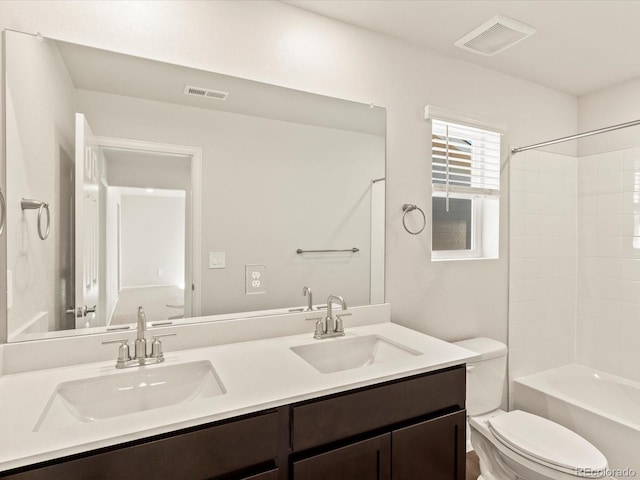 full bathroom featuring toilet, vanity, and shower / bathtub combination