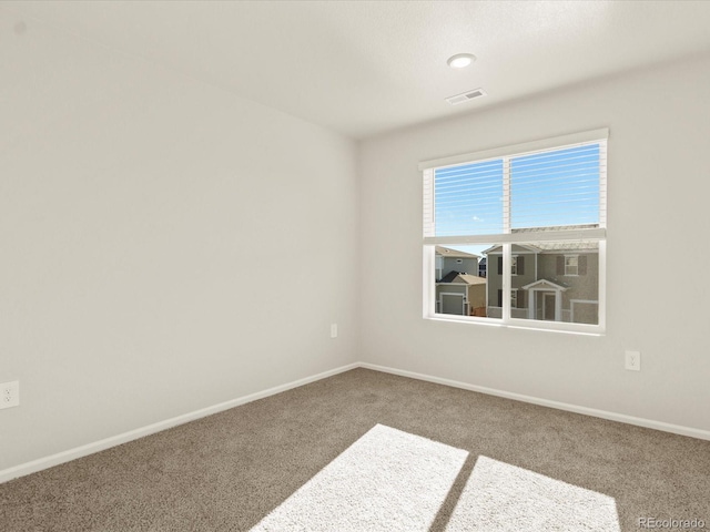 view of carpeted spare room