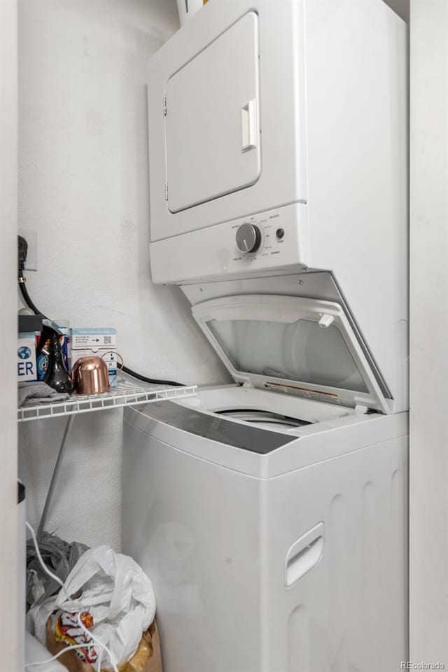 laundry room featuring laundry area and stacked washing maching and dryer