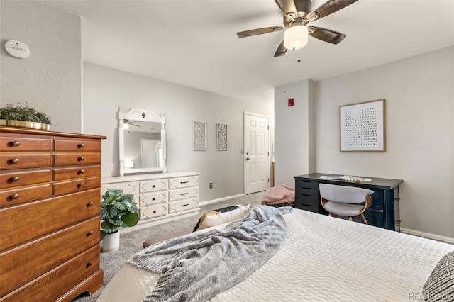 bedroom with ceiling fan, baseboards, and carpet floors