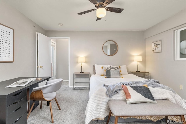 carpeted bedroom featuring baseboards and ceiling fan