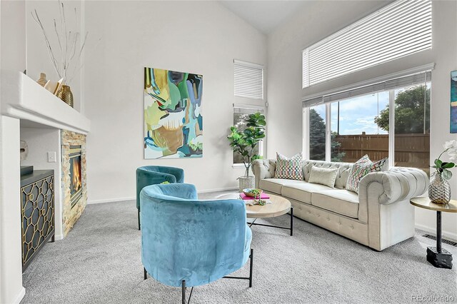10115 Foxridge Ct, Highlands Ranch, CO 80126 - carpeted living room featuring high vaulted ceiling and a fireplace