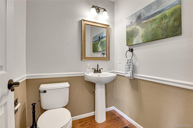 10115 Foxridge Ct, Highlands Ranch, CO 80126 - half bath featuring wood finished floors and toilet