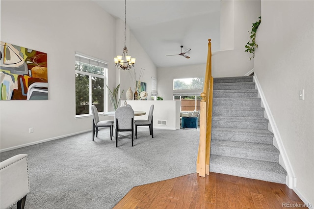 10115 Foxridge Ct, Highlands Ranch, CO 80126 - dining area featuring stairs, carpet floors, high vaulted ceiling, a chandelier, and ceiling fan