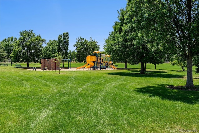 view of playground with a lawn