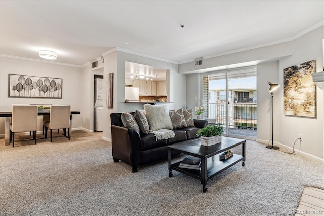 carpeted living room with crown molding