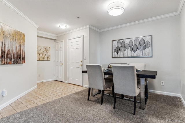 dining room with crown molding and light tile patterned floors