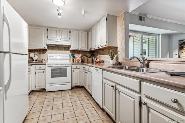 kitchen with light tile patterned floors, white appliances, white cabinetry, and sink