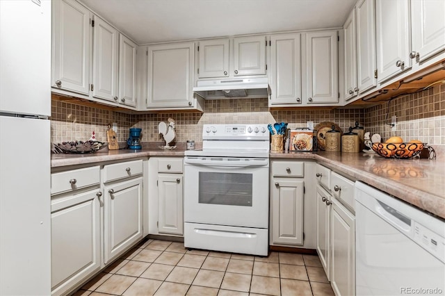 kitchen with backsplash, white cabinets, light tile patterned flooring, and white appliances