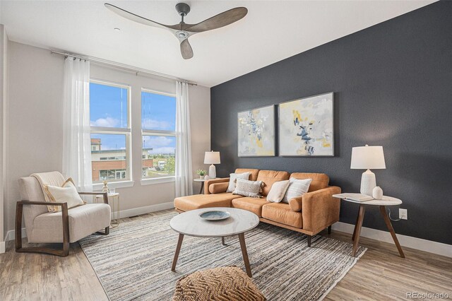 9072 E 47th Ave, Denver, CO 80238 - living area featuring light wood-type flooring, ceiling fan, and baseboards