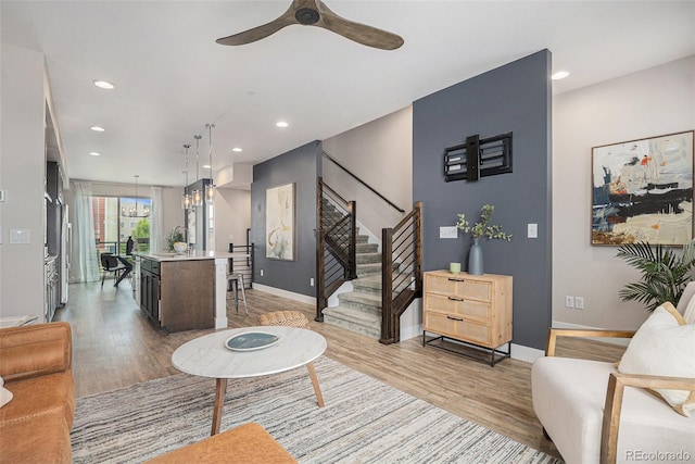 9072 E 47th Ave, Denver, CO 80238 - living area with light wood finished floors, baseboards, stairs, a ceiling fan, and recessed lighting