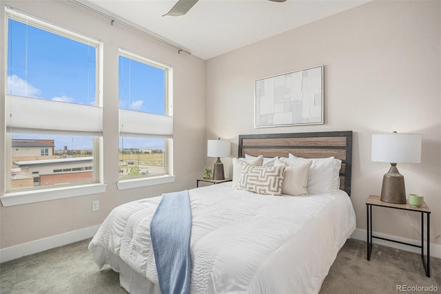 9072 E 47th Ave, Denver, CO 80238 - carpeted bedroom with multiple windows, baseboards, and a ceiling fan