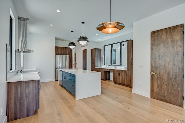 414 E Arkansas St, Buena Vista, CO 81211 - kitchen with wall chimney range hood, stainless steel appliances, light countertops, modern cabinets, and recessed lighting