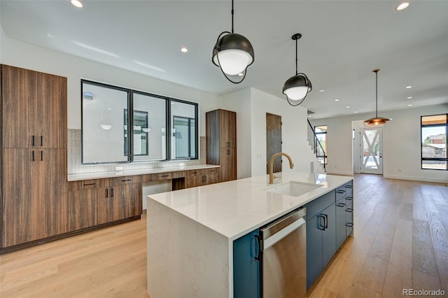 414 E Arkansas St, Buena Vista, CO 81211 - kitchen featuring stainless steel dishwasher, light wood-type flooring, decorative light fixtures, an island with sink, and recessed lighting