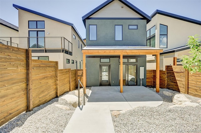 414 E Arkansas St, Buena Vista, CO 81211 - back of house with stucco siding and a patio