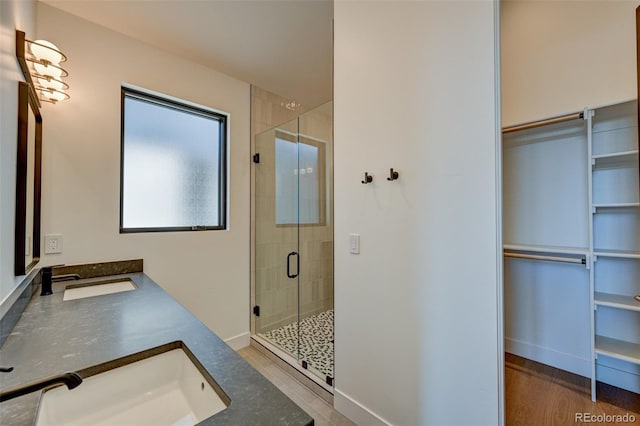 414 E Arkansas St, Buena Vista, CO 81211 - full bathroom featuring a stall shower, double vanity, and a spacious closet